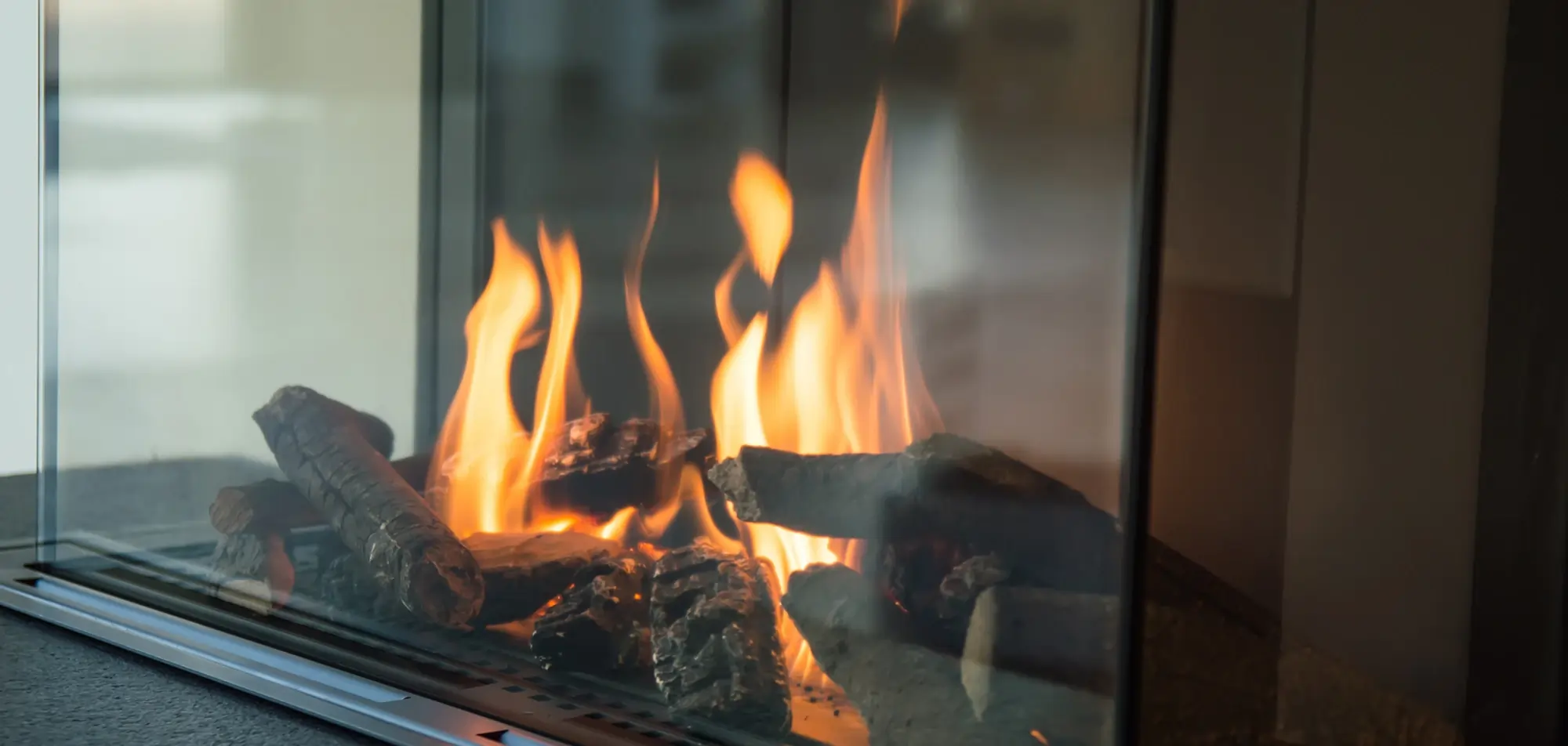 Gas fireplace burner producing an even flame during inspection
